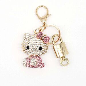 Authentic Louis Vuitton Lock & Key with unbranded Hello Kitty Bagcharm, Keycharm